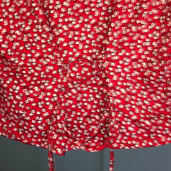 red w/ white flowers shirt with tie in the back. - Picture 3 of 4